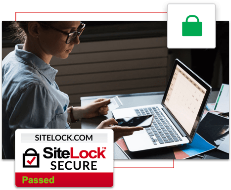 SiteLock Secure logo with woman looking at credit card, laptop, and mobile phone at desk
